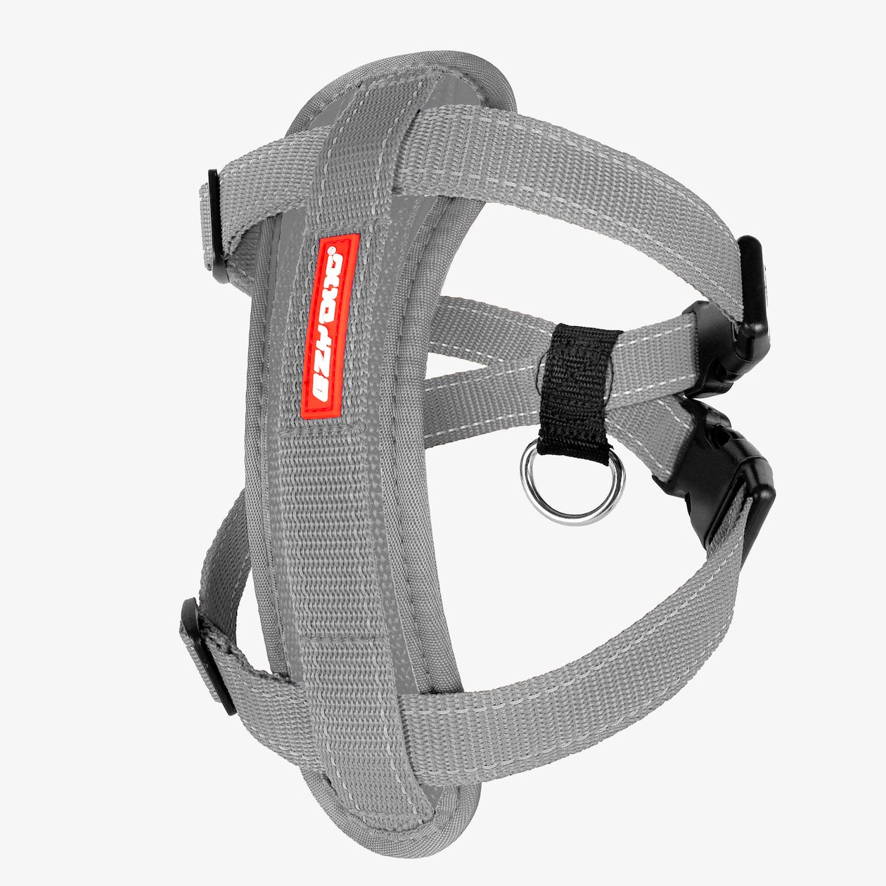 A gray Chest Plate Dog Harness with adjustable straps, a metal ring, and a label showing the brand name.