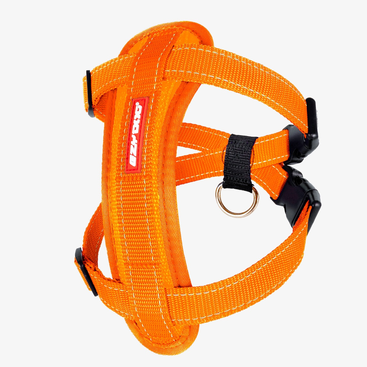An orange Chest Plate Dog Harness with adjustable straps, a metal ring, and a label showing the brand name.