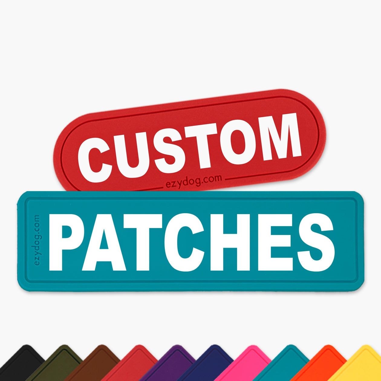 Two custom die-cut patches on a light gray background: a red rounded rectangle patch reading 'CUSTOM' and a teal rounded rectangle patch reading 'PATCHES'. Small 'ezydog.