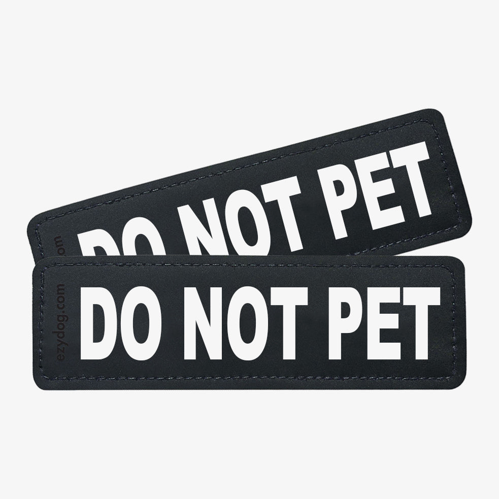 Black and white side badges that say "DO NOT PET"