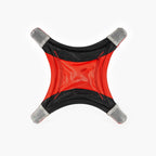 Red and black star-shaped object with gray accents on a white background