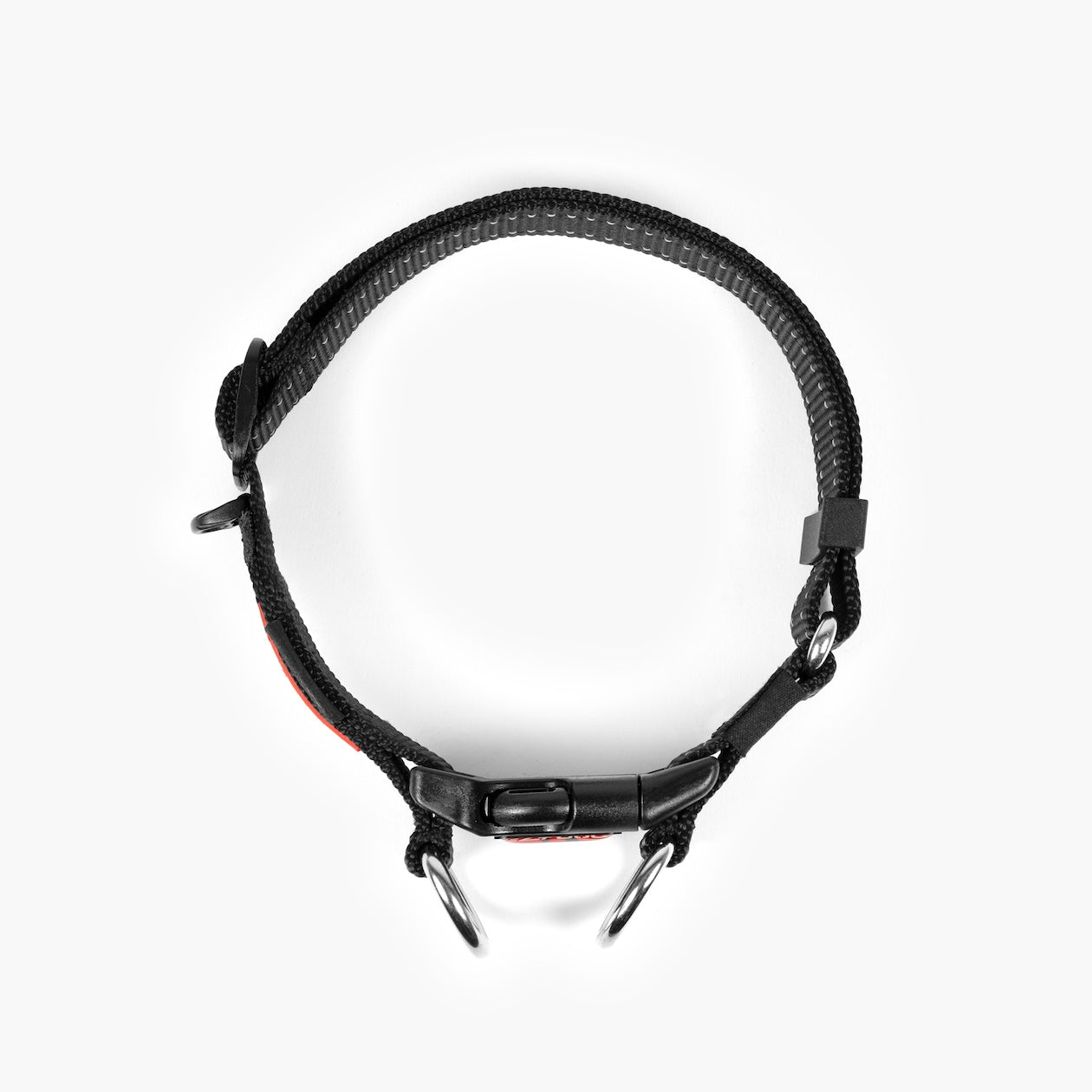 Black dog collar with red accents on a white background