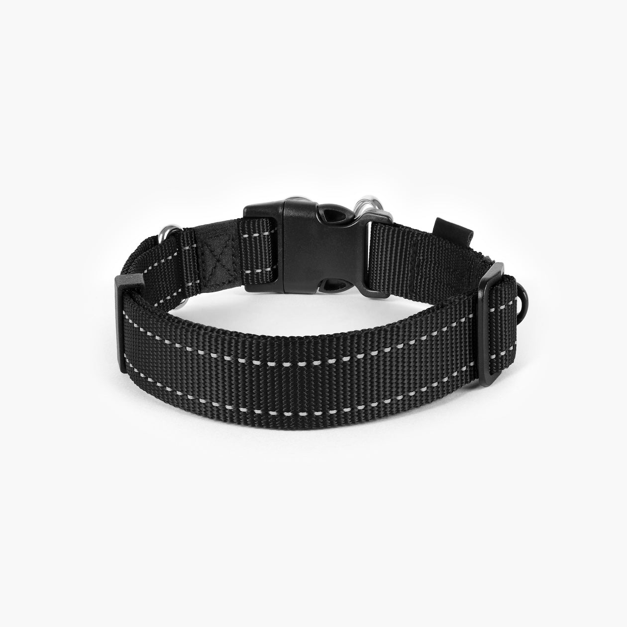 Black dog collar with white stitching on a white background