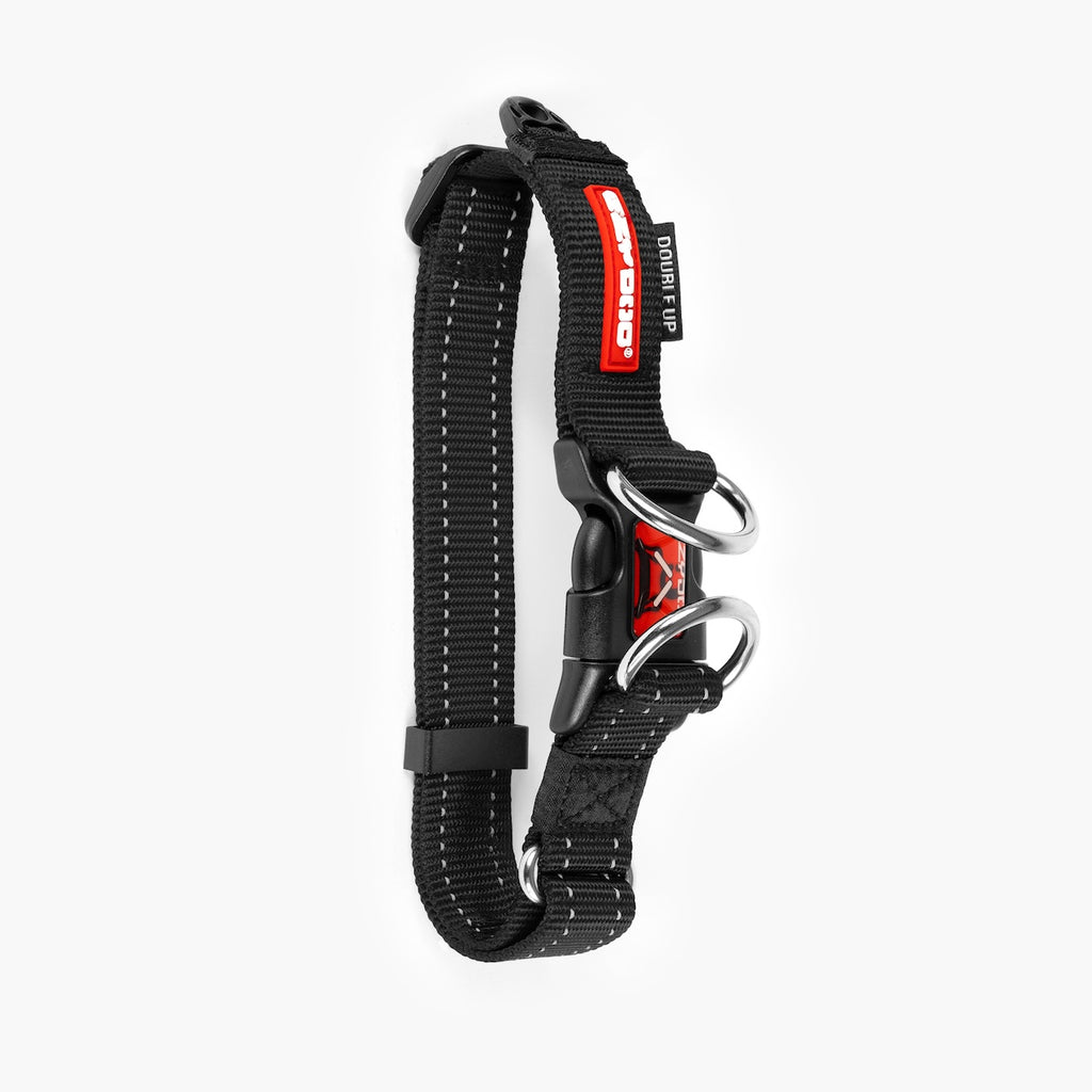 Black dog collar with red accents on a white background