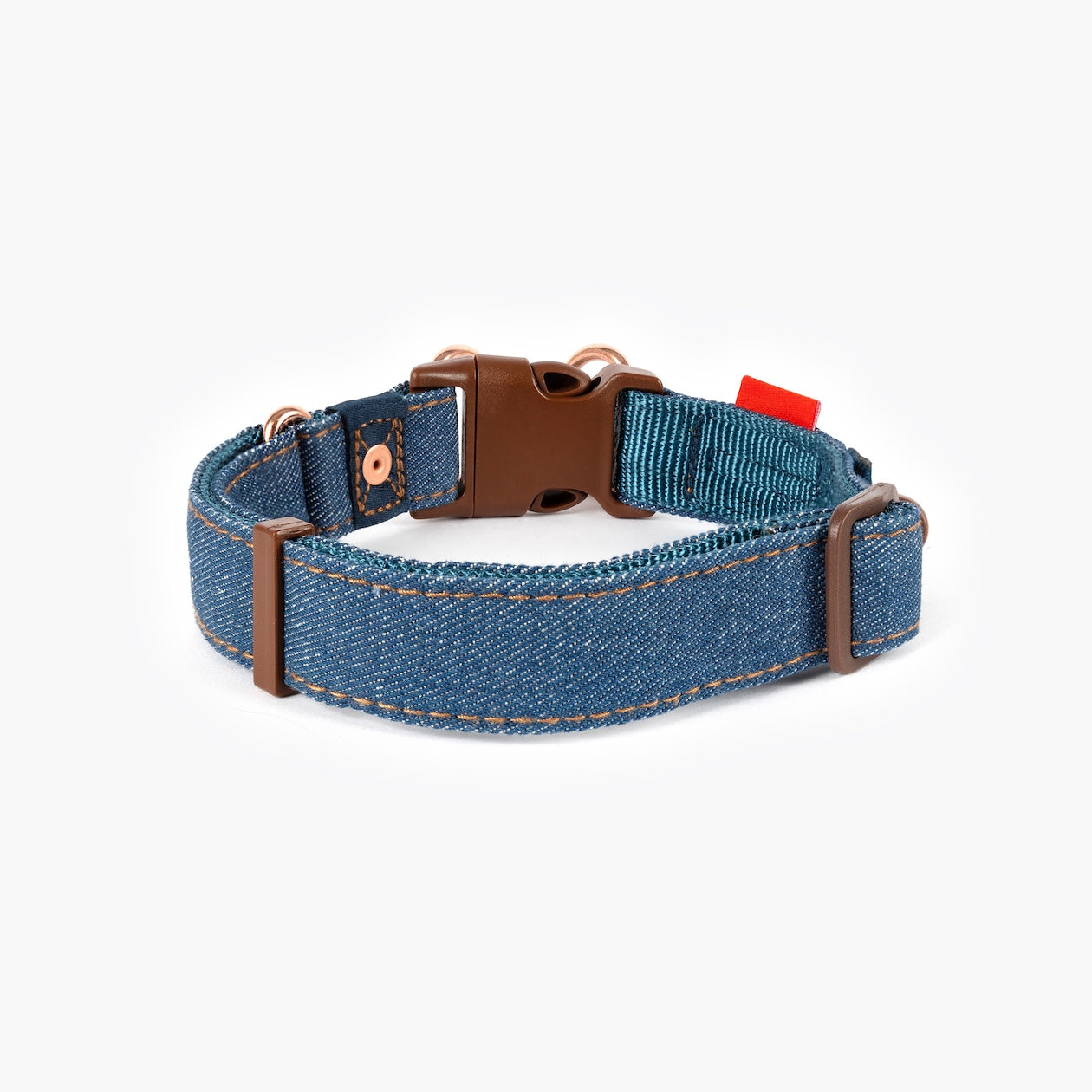 Blue dog collar with brown buckle on a white background