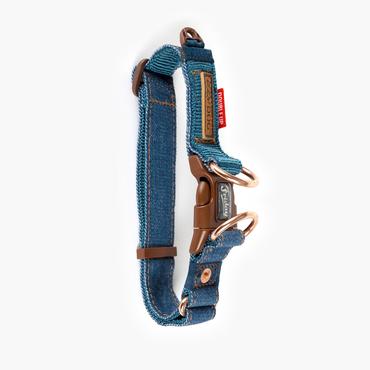 Blue denim dog collar with brown hardware on a white background
