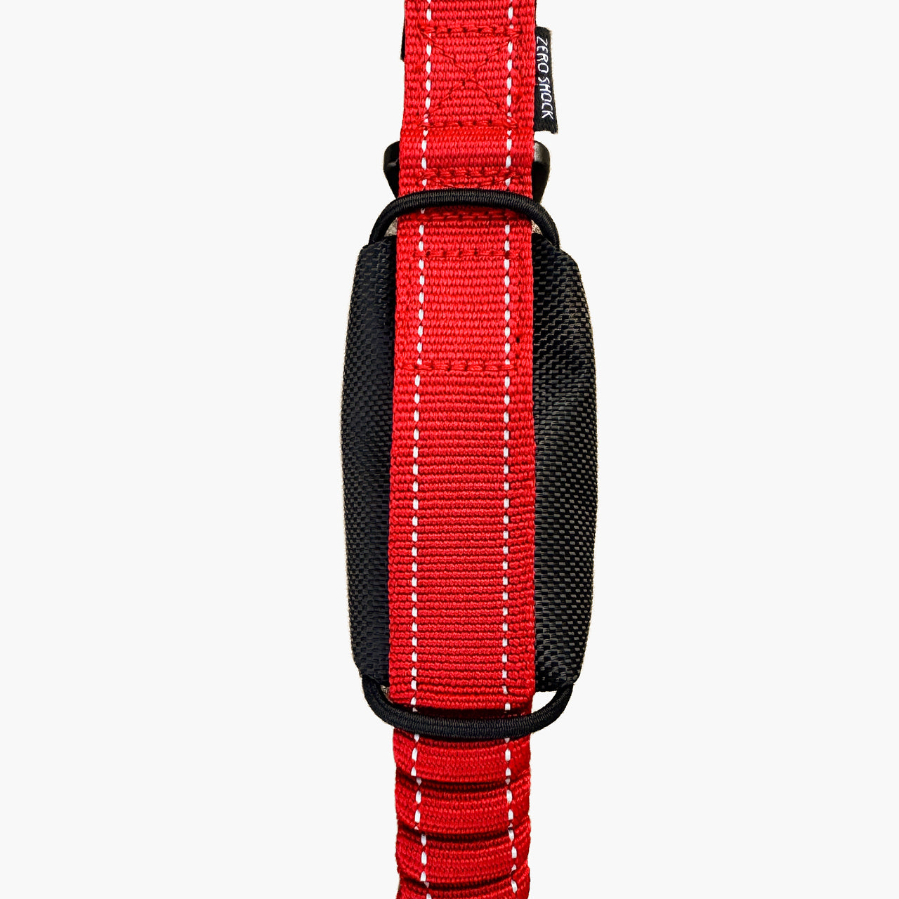 A close-up of a red and black dog collar with white contrast stitching and a black plastic buckle, shown against a light gray background.