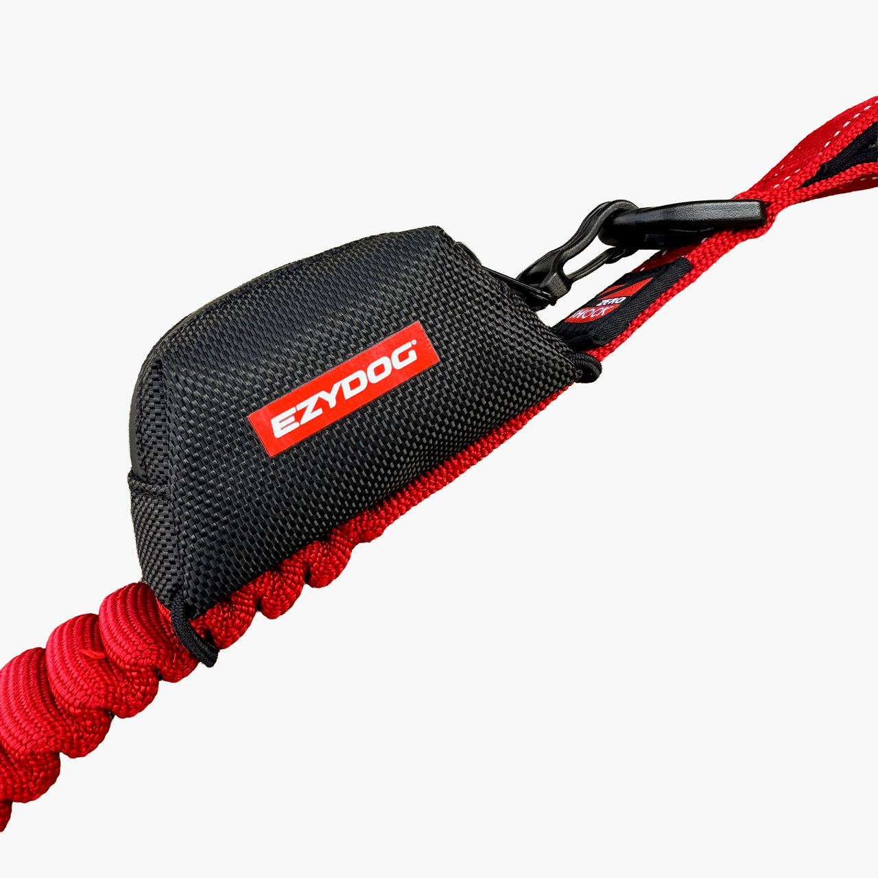 A close-up of a red and black EzyDog leash with a black mesh handle and red braided cord, shown against a light gray background.