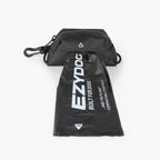 Dog poop bag pulled from the EzyDog Essential Poop Bag Holder