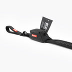 A black EzyDog Essential poop Bag Holder attached to an EzyDog leash showing seabless integrated attachment and poop bag access