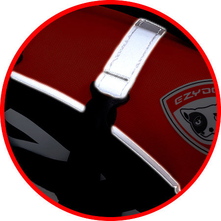 Close-up of a reflective strip on a red fabric background with a brand logo.
