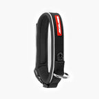 Black dog collar with red tag on a white background