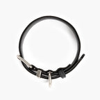 Black leather collar with silver hardware on a white background