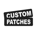 Two black rectangular patches with bold white text reading 'CUSTOM PATCHES' on a plain white background.