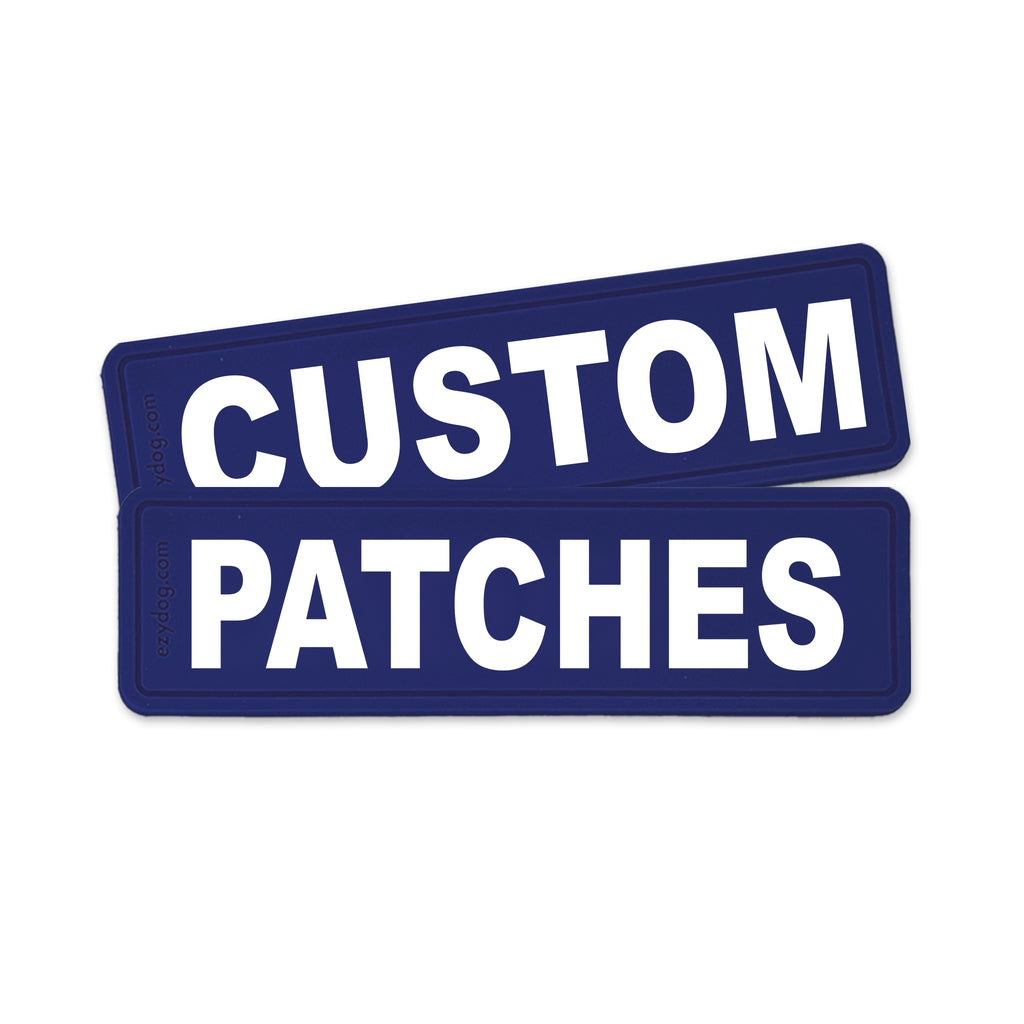 Two dark blue rectangular patches with bold white text reading 'CUSTOM PATCHES' on a plain white background.