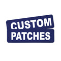 Two dark blue rectangular patches with bold white text reading 'CUSTOM PATCHES' on a plain white background.