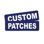 Two dark blue rectangular patches with bold white text reading 'CUSTOM PATCHES' on a plain white background.