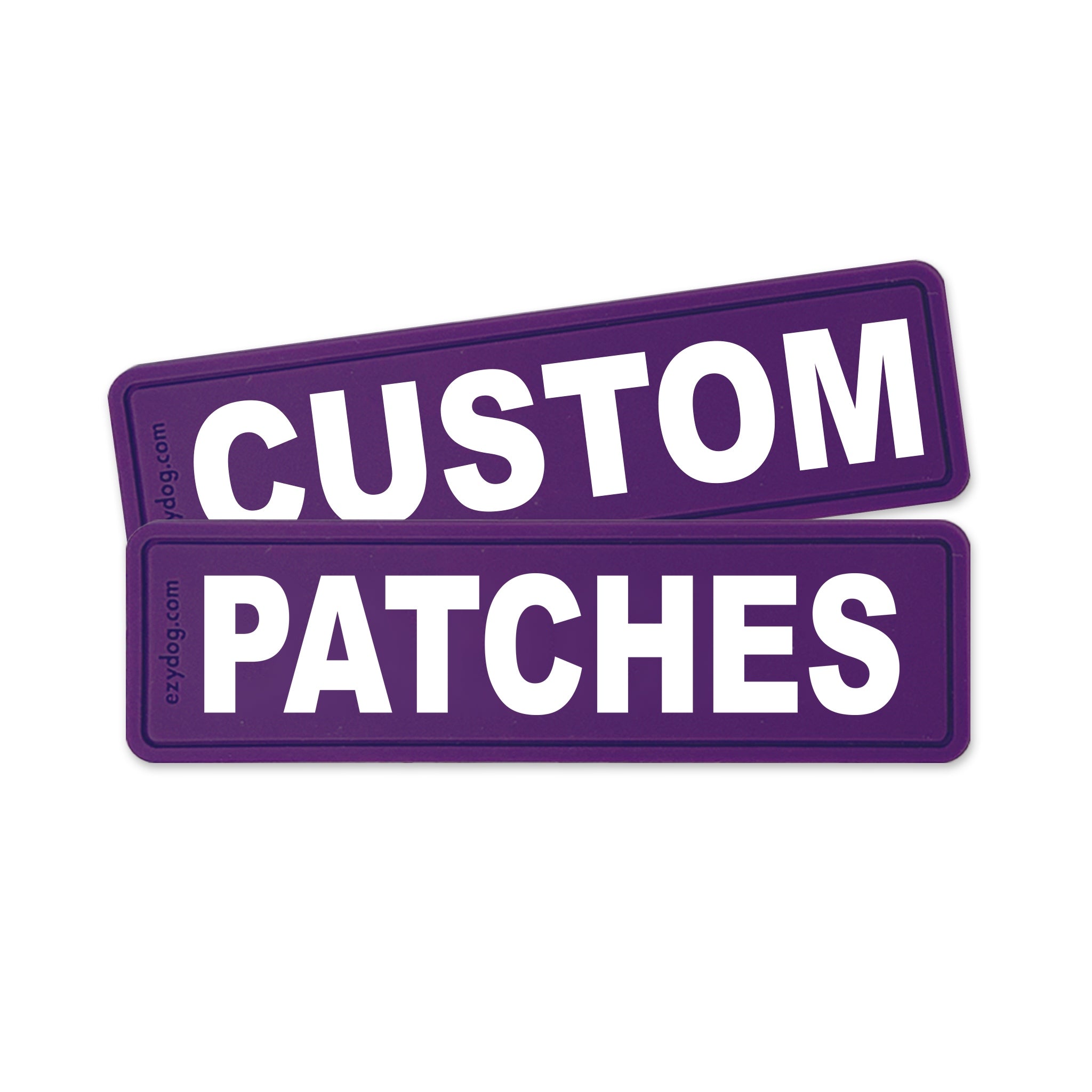 Two purple rectangular patches with rounded corners stacked slightly offset, featuring the words 'CUSTOM PATCHES' in large white uppercase letters. Small vertical text on the left edge reads 'ezpatches.