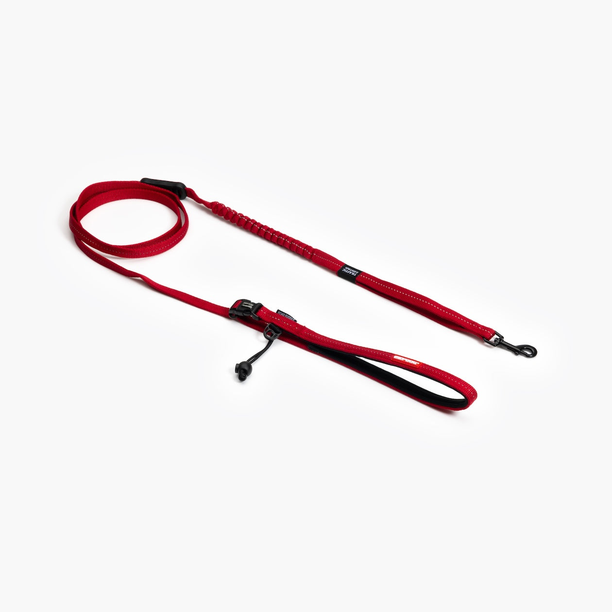 Red dog leash with black clips on a white background