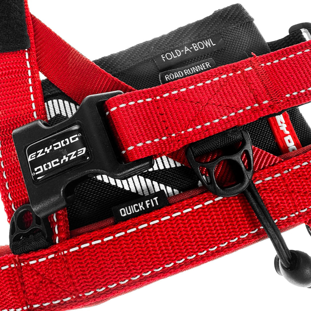 Red dog harness with quick fit buckle and EzyDog branding on a white background