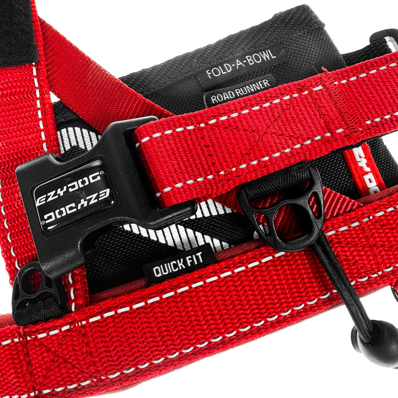 Red dog harness with quick fit buckle and EzyDog branding on a white background