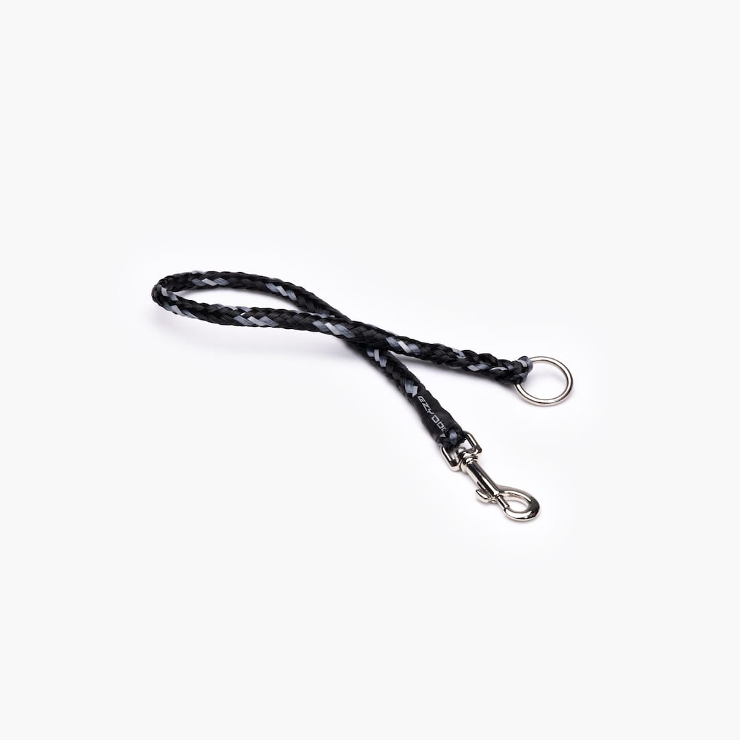 A black bungee leash extension with a metal clasp on each end, isolated on a white background.