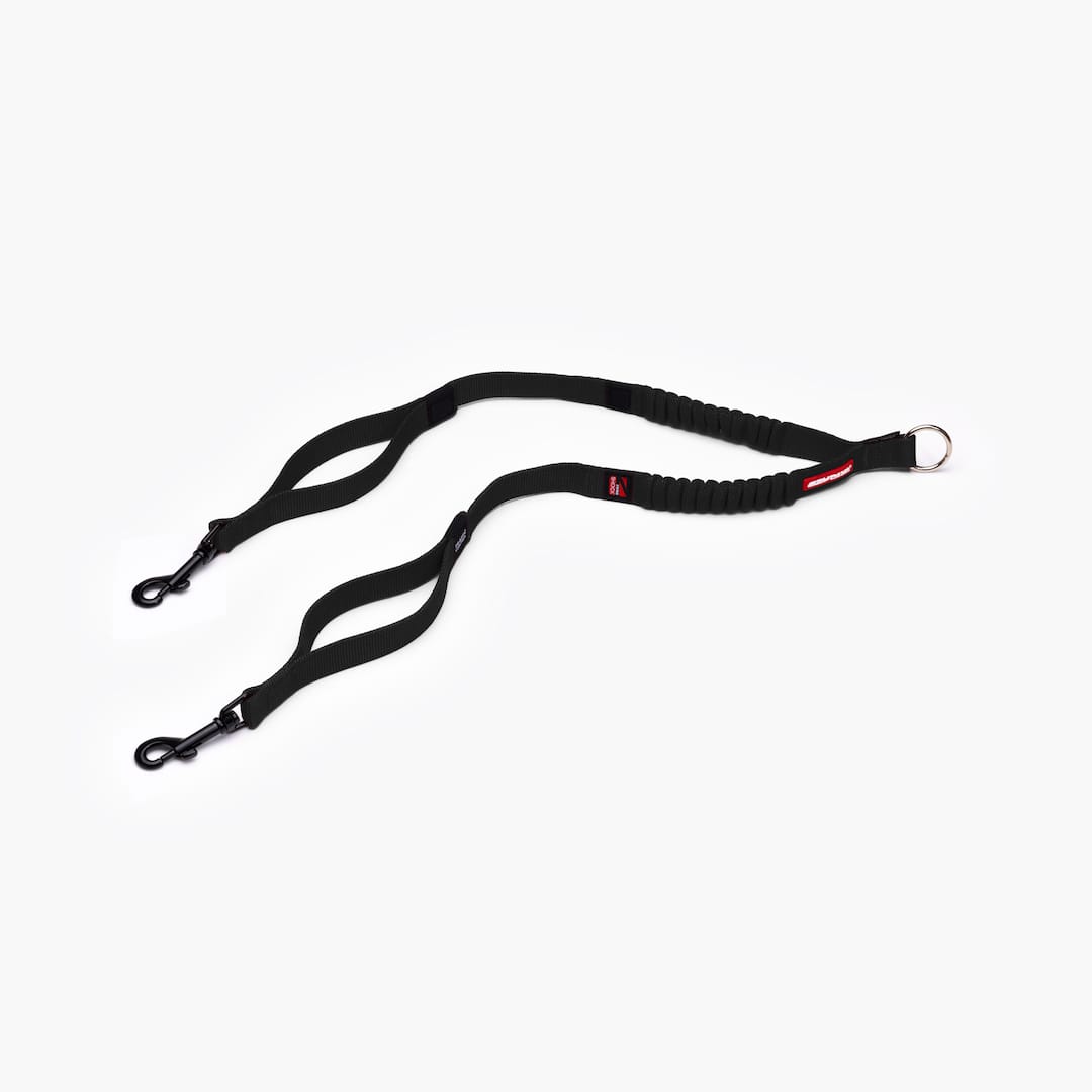 A black Zero Shock Couplers leash with a tangle-free traffic handle and proprietary super soft webbing.