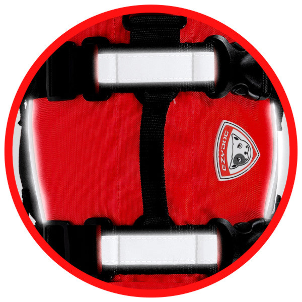 Close up of reflective strips on a red dog life jacket