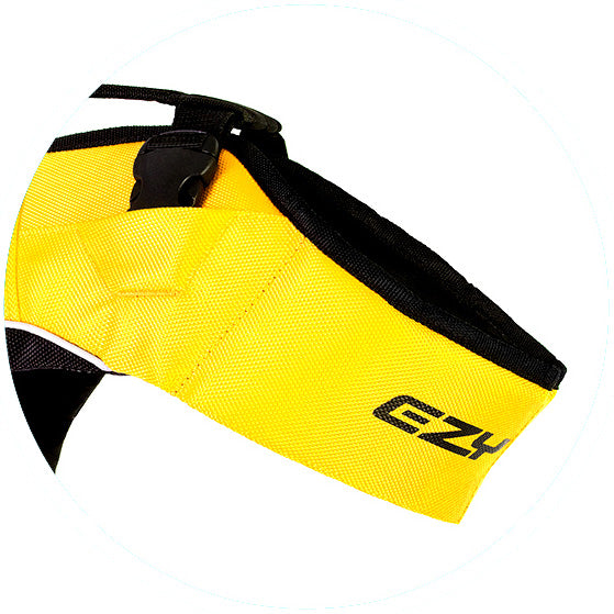 Yellow knee brace with black straps on a white background